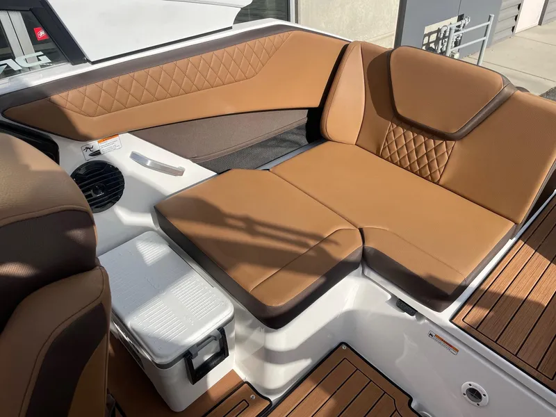 Slide: The Image of 2025 Yamaha Boats 222SD interior with tan leather seating and modern design. - 7