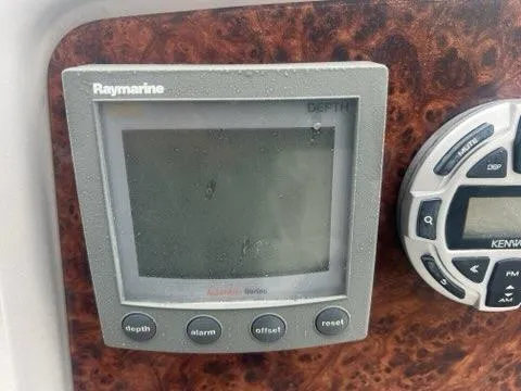 Slide: The Image of Raymarine depth gauge and control panel on 2004 Formula 34 PC boat. - 12