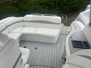 Slide: The Image of 2004 Formula 34 PC boat with white seating and gray deck. - 15