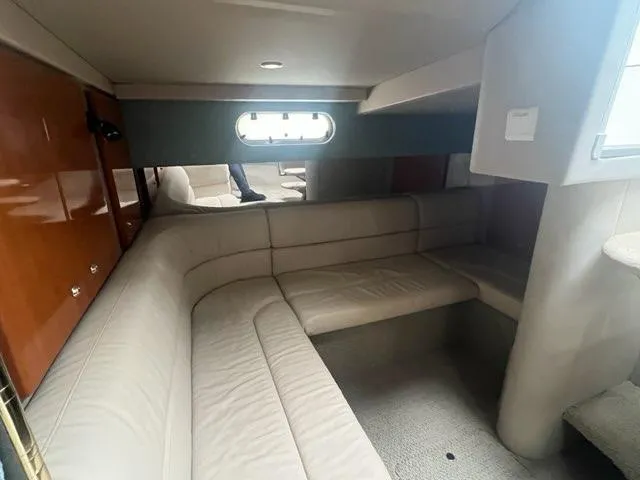 Slide: The Image of Interior of 2004 Formula 34 PC yacht with beige seating and wood accents. - 19