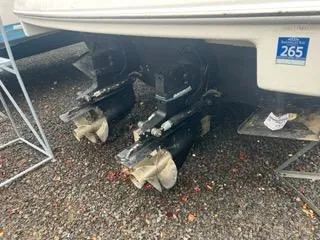 Slide: The Image of 2004 Formula 34 PC boat propellers on gravel surface. - 24