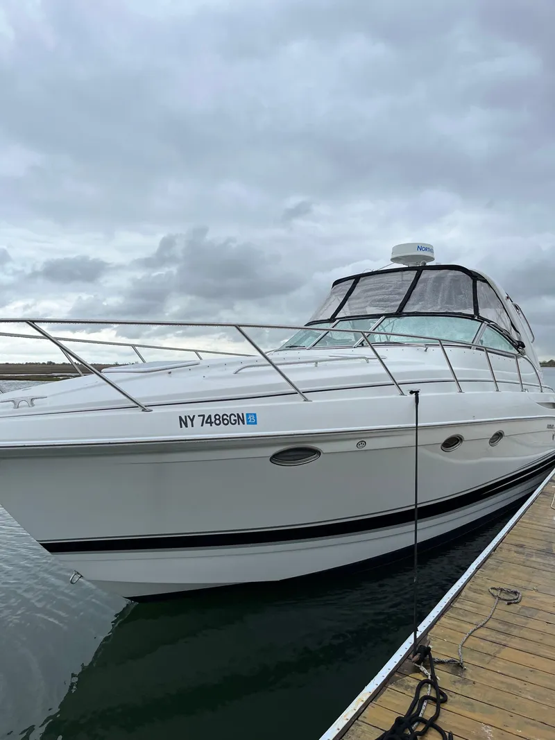 Slide: The Image of 2004 Formula 34 PC yacht docked under cloudy skies. - 3