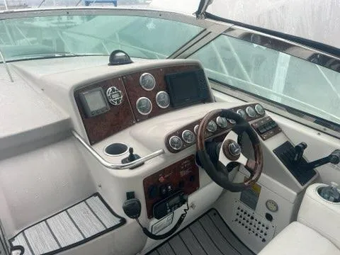 Slide: The Image of 2004 Formula 34 PC boat dashboard with steering wheel and navigation controls. - 9