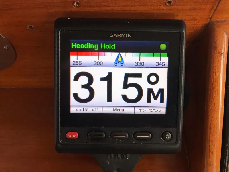 Slide: The Image of Garmin navigation display showing heading hold at 315 degrees on a 1969 Grand Banks 42 Classic. - 11