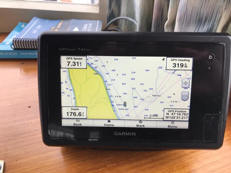 Slide: The Image of Garmin GPS display on 1969 Grand Banks 42 Classic, showing speed, heading, and depth. - 12