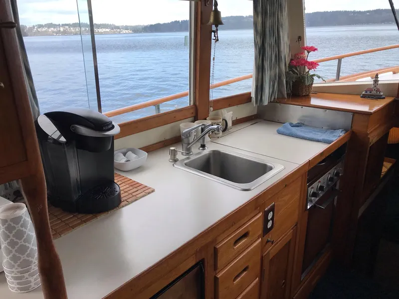 Slide: The Image of Interior of 1969 Grand Banks 42 Classic yacht with kitchen and ocean view. - 19
