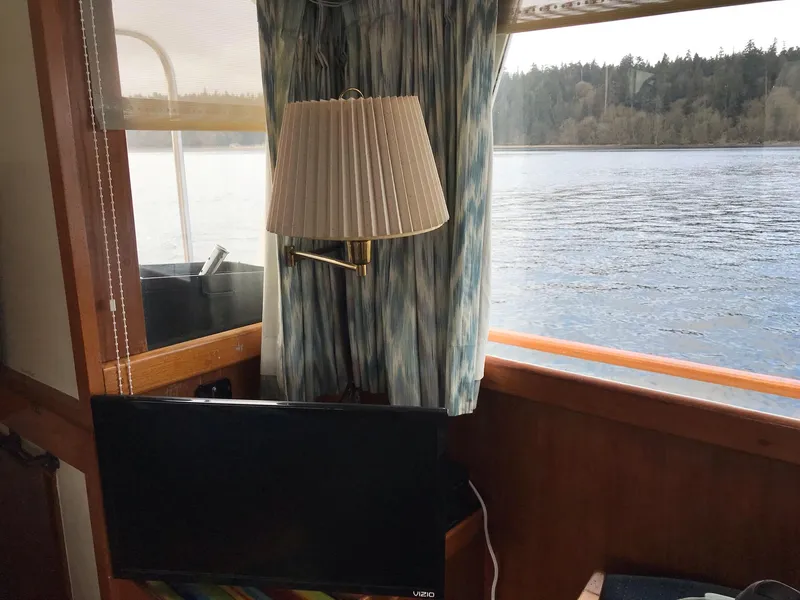 Slide: The Image of Interior of 1969 Grand Banks 42 Classic yacht with window view of water. - 20