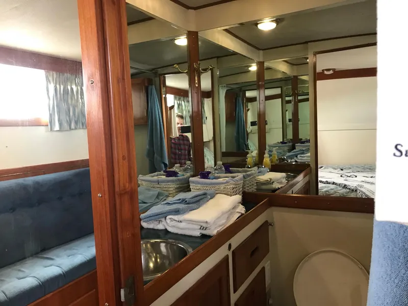 Slide: The Image of Interior of 1969 Grand Banks 42 Classic yacht with wood paneling and cozy furnishings. - 25