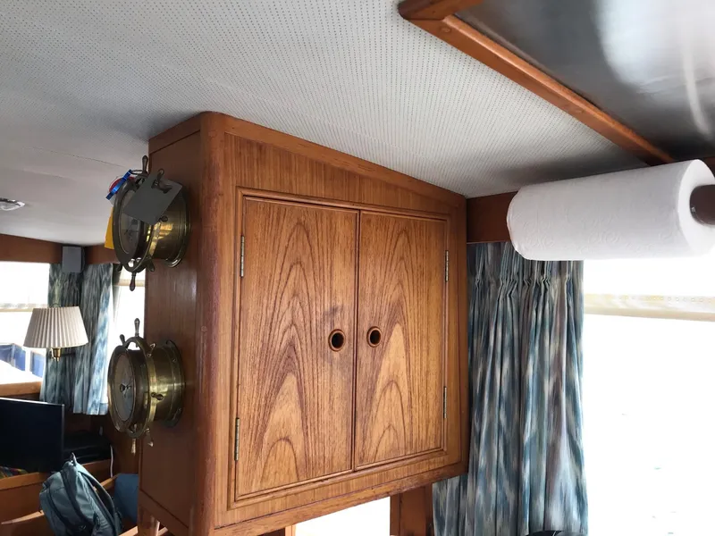 Slide: The Image of Interior of 1969 Grand Banks 42 Classic with wooden cabinet and nautical decor. - 39