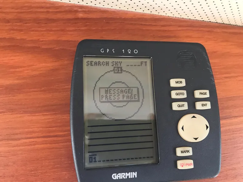 Slide: The Image of Garmin GPS 120 device on 1969 Grand Banks 42 Classic boat dashboard. - 41