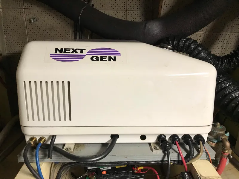 Slide: The Image of Next Gen generator in a 1969 Grand Banks 42 Classic boat engine room. - 43