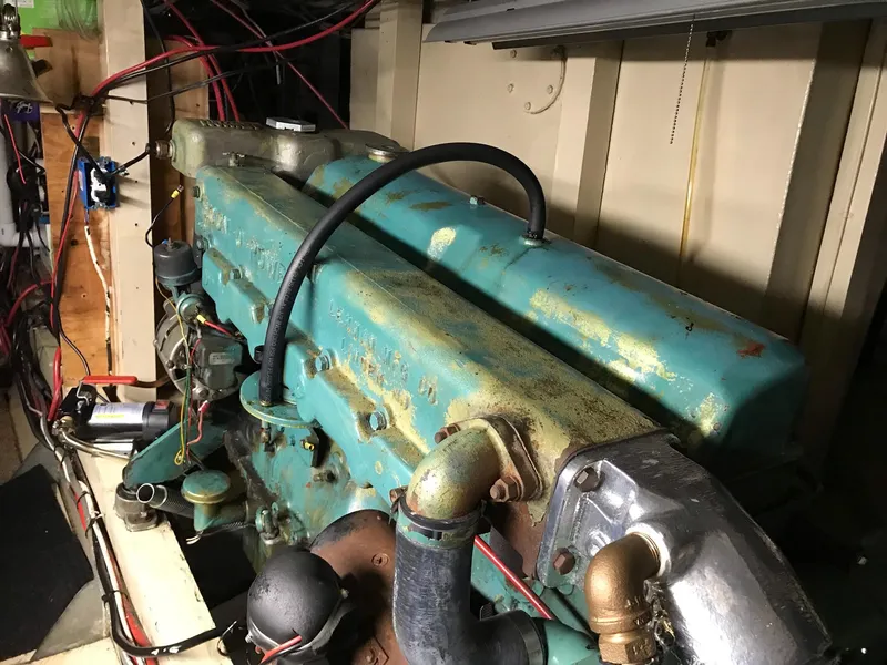 Slide: The Image of Engine of a 1969 Grand Banks 42 Classic boat, showing vintage mechanical components. - 45