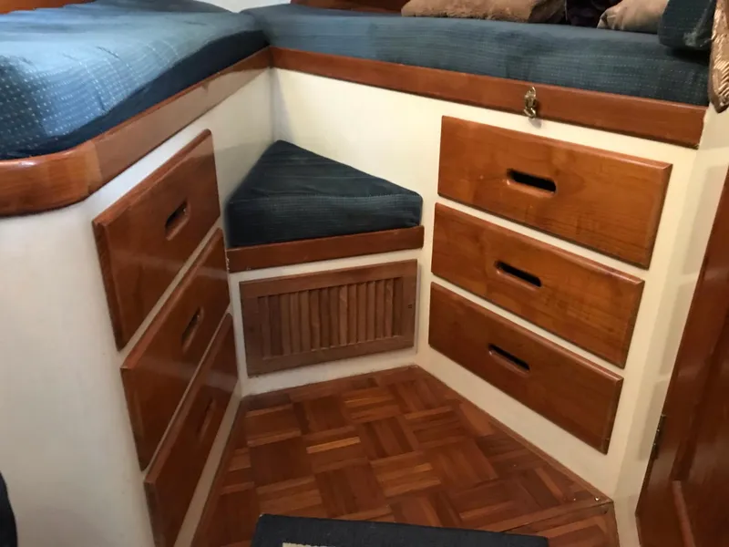 Slide: The Image of Interior of 1969 Grand Banks 42 Classic with wooden drawers and cushioned seating. - 7