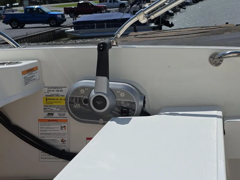 Slide: The Image of 2025 Boston Whaler 160 Super Sport boat control panel and throttle lever. - 10