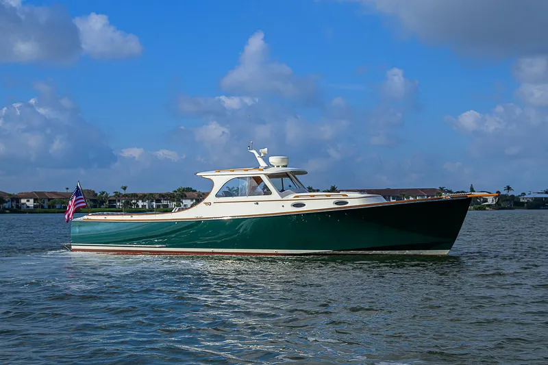 Slide: The Image of 2000 Hinckley Picnic Boat Classic cruising on a sunny day with blue skies. - 3