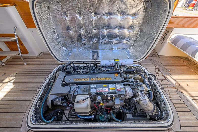 Slide: The Image of Engine compartment of a 2000 Hinckley Picnic Boat Classic, showcasing detailed mechanical components. - 22