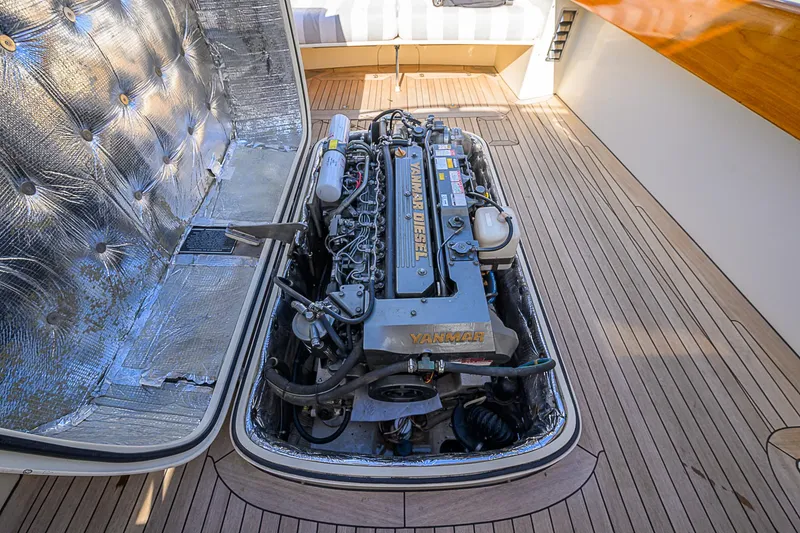 Slide: The Image of Engine compartment of a 2000 Hinckley Picnic Boat Classic, showcasing a Yanmar diesel engine. - 23