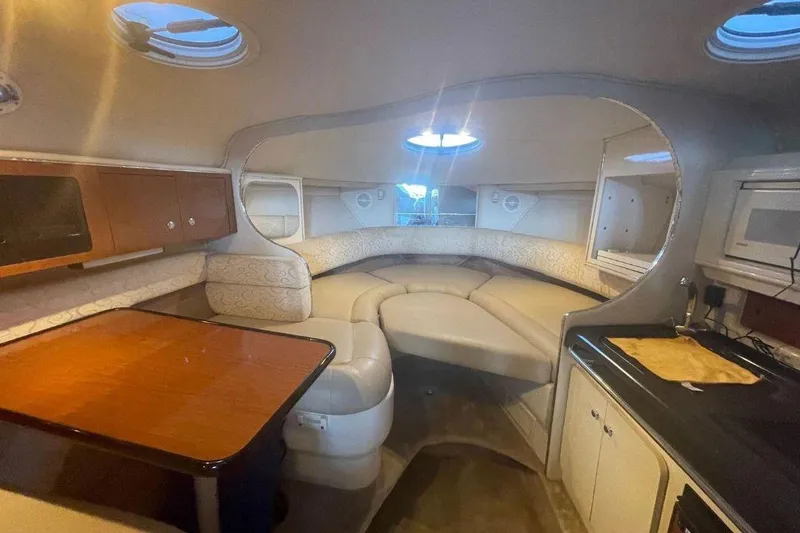 Slide: The Image of Interior of 2003 Monterey 302 Cruiser with cozy seating and kitchenette. - 7