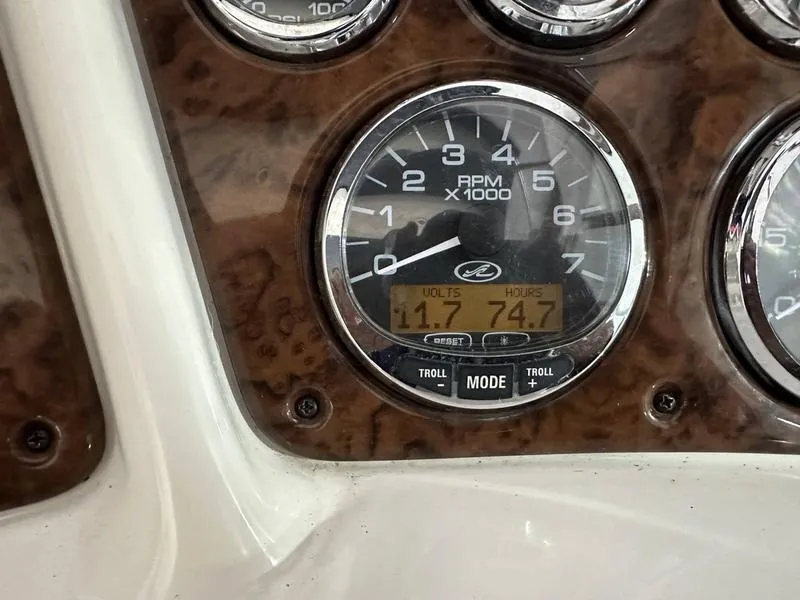 Slide: The Image of 2004 Sea Ray 260 Sundancer boat on trailer in indoor storage facility. - 1