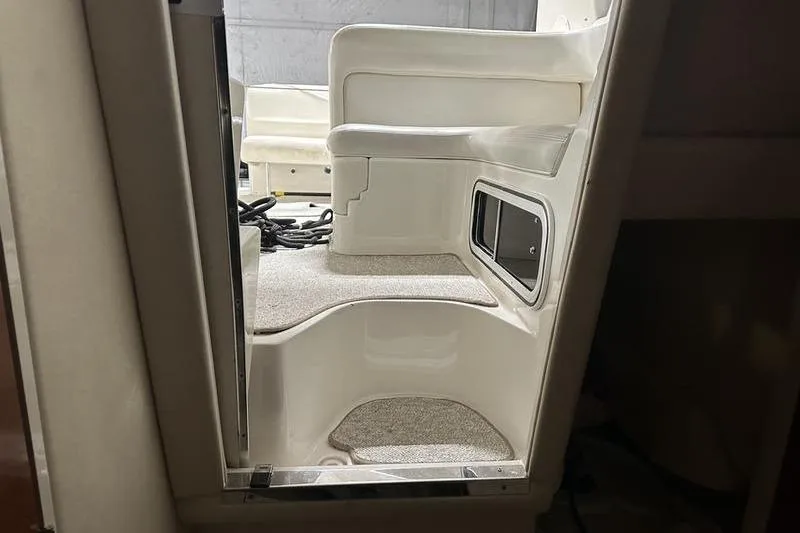 Slide: The Image of 2004 Sea Ray 260 Sundancer interior with steps and seating area. - 19