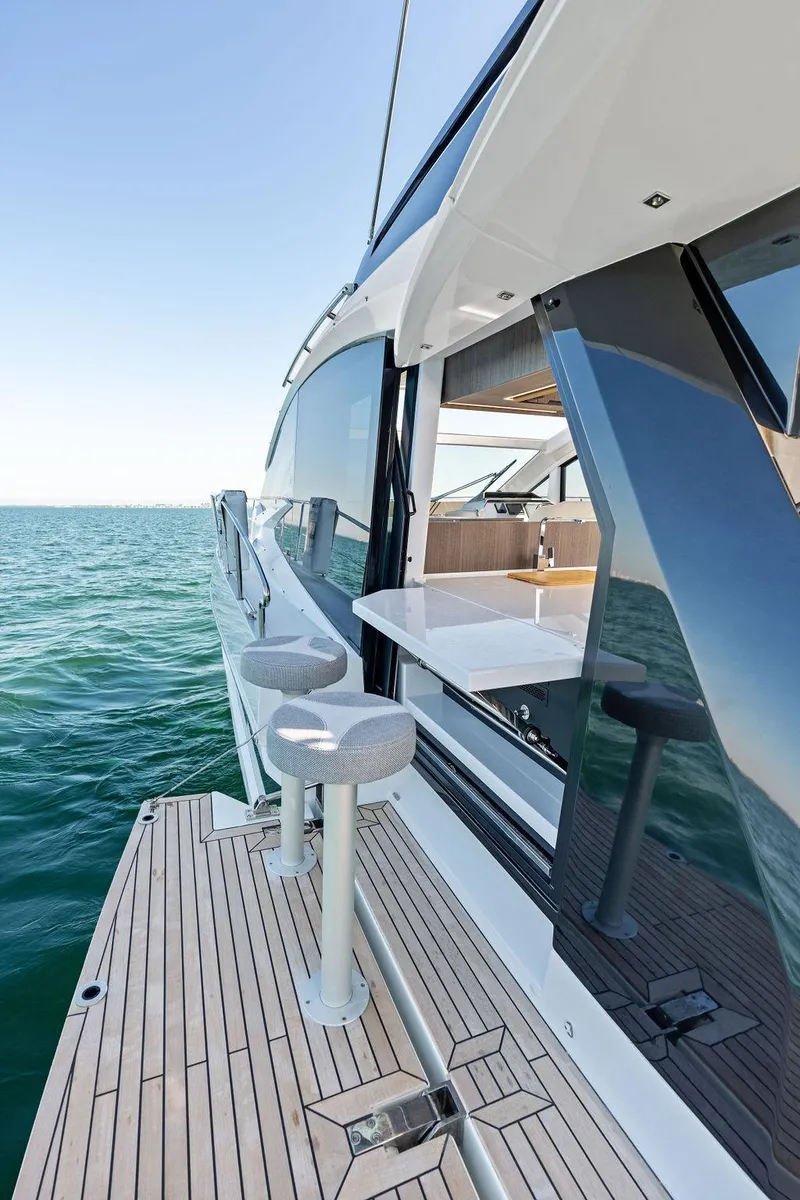 Slide: The Image of 2024 Galeon 470 Sky yacht with sleek design and ocean view. - 13