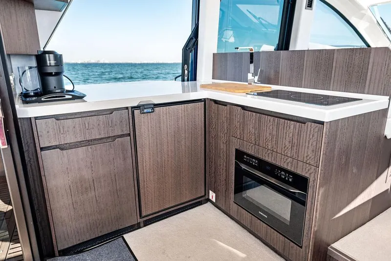 Slide: The Image of Modern kitchen in 2024 Galeon 470 Sky yacht with ocean view. - 23
