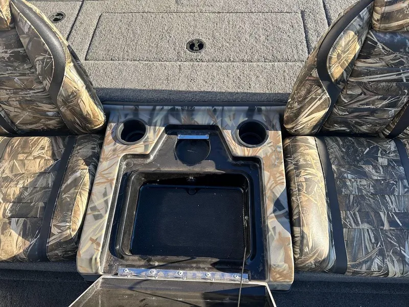 Slide: The Image of 2024 Ranger RT188P boat interior with camo seats and storage compartment. - 14