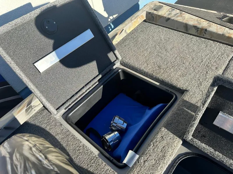 Slide: The Image of 2024 Ranger RT188P boat storage compartment with accessories inside. - 18
