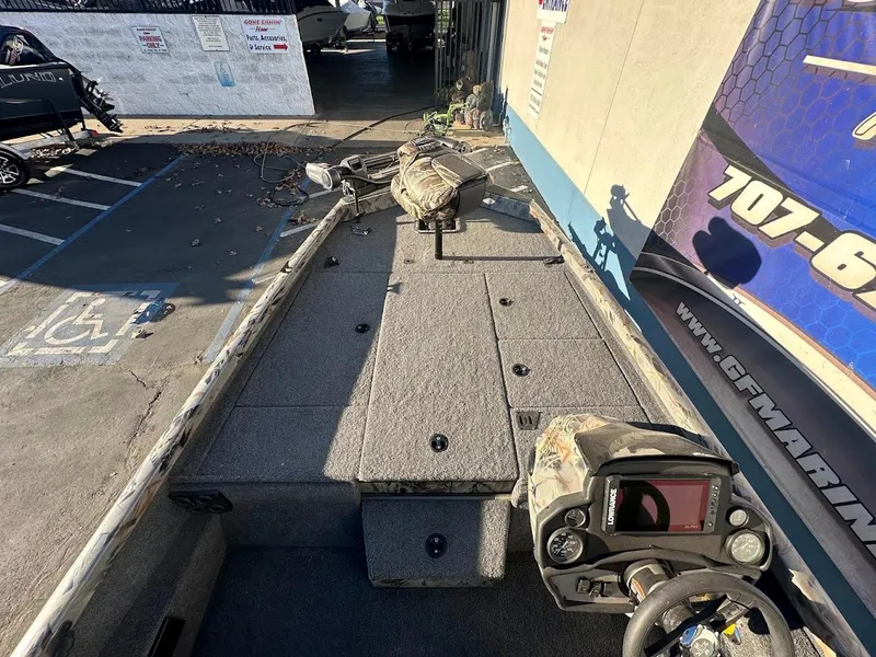 Slide: The Image of 2024 Ranger RT188P fishing boat interior with control panel and deck. - 21