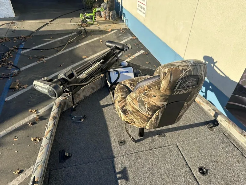 Slide: The Image of 2024 Ranger RT188P boat with camo seat and trolling motor on deck. - 22