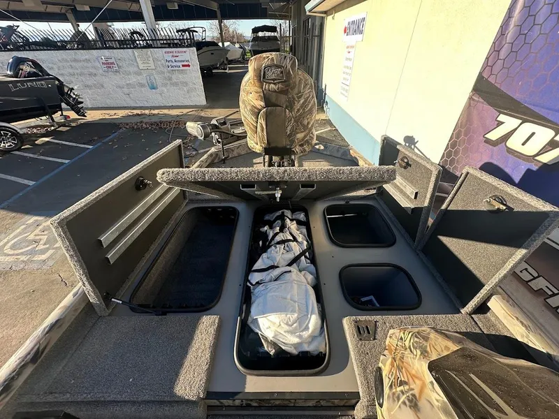 Slide: The Image of 2024 Ranger RT188P boat interior with storage compartments open. - 26