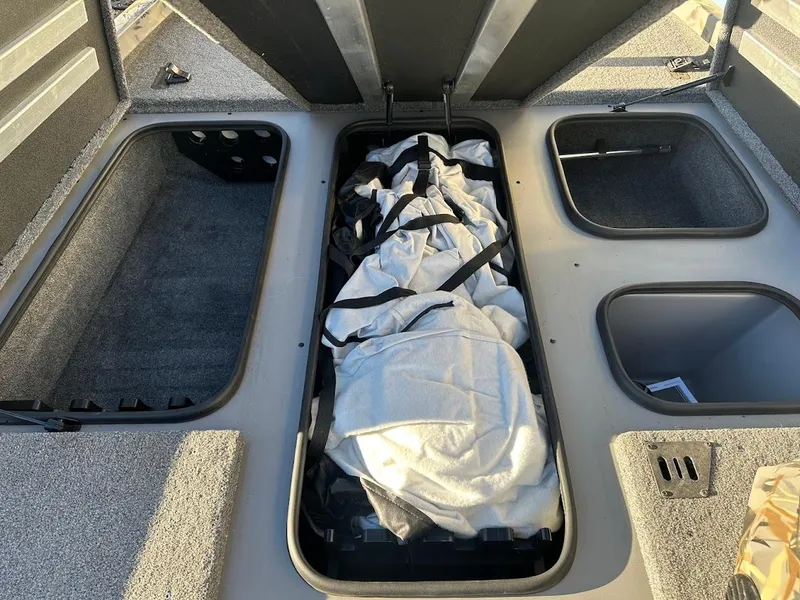 Slide: The Image of 2024 Ranger RT188P boat storage compartments with gear and equipment. - 29