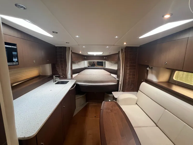 Slide: The Image of Luxurious interior of 2016 Sea Ray 370 Sundancer yacht with modern amenities. - 23