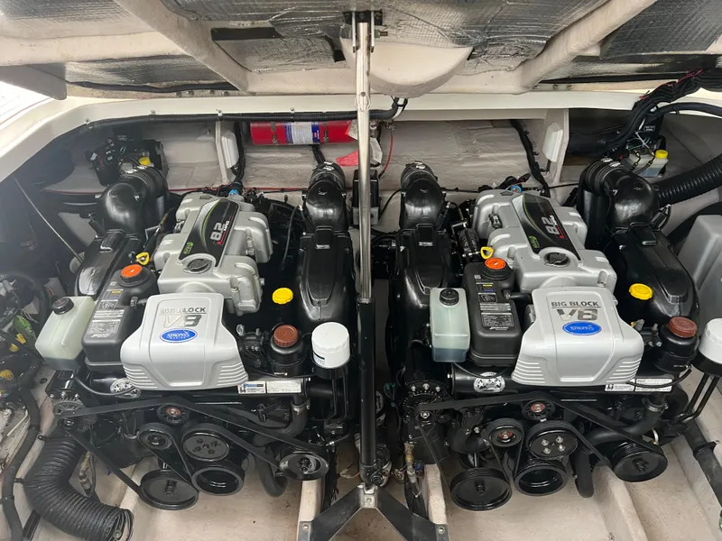 Slide: The Image of Twin engines in a 2016 Sea Ray 370 Sundancer boat engine compartment. - 27