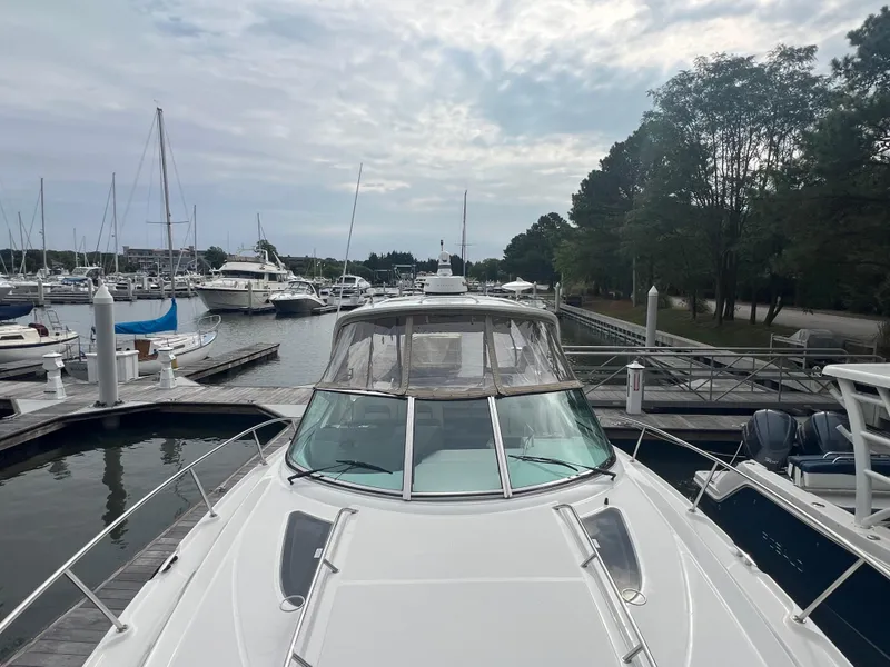 Slide: The Image of 2016 Sea Ray 370 Sundancer docked at a marina with other boats. - 32