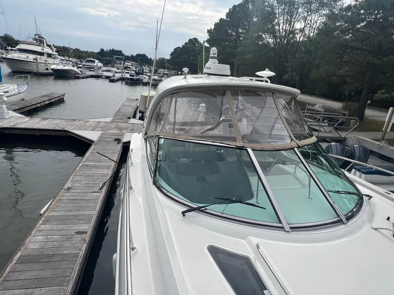Slide: The Image of 2016 Sea Ray 370 Sundancer docked at a marina with other boats. - 34