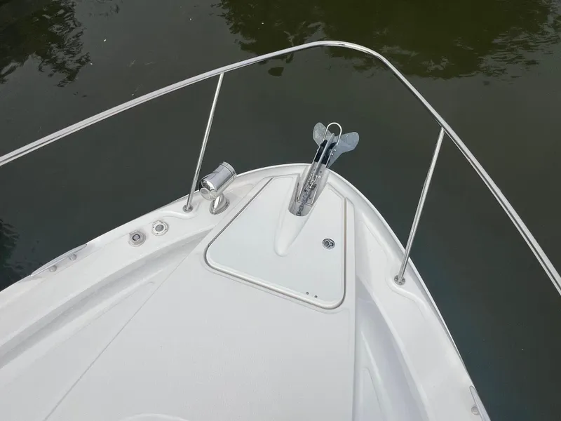 Slide: The Image of Bow of 2016 Sea Ray 370 Sundancer with anchor, on calm water. - 37