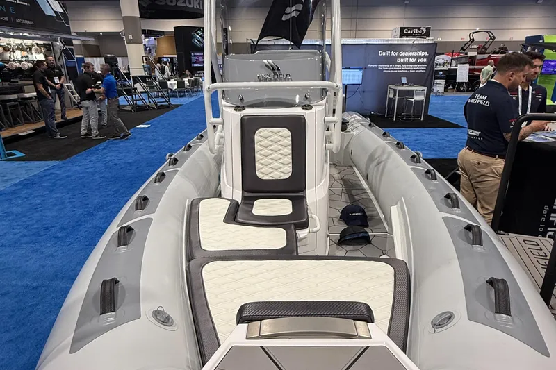 Slide: The Image of 2025 Highfield Sport 560 boat interior at a marine exhibition. - 13