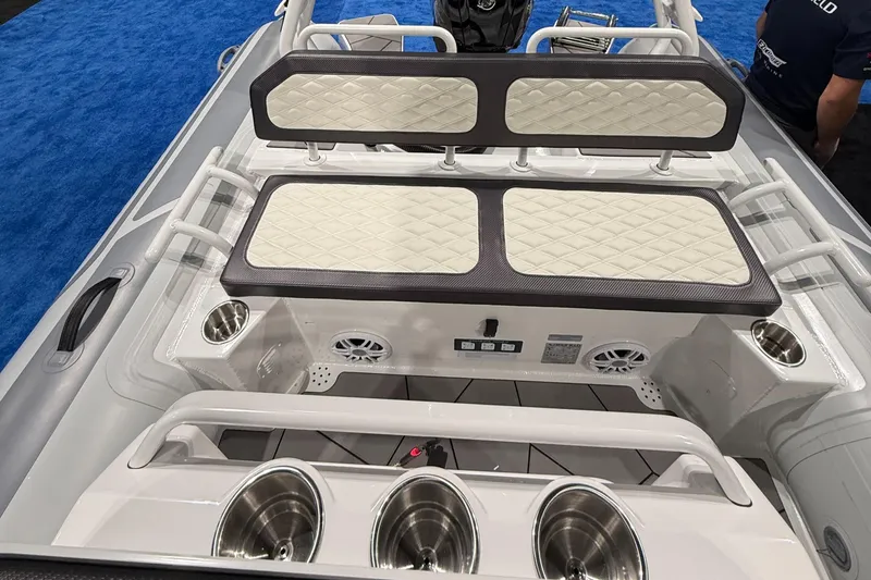 Slide: The Image of 2025 Highfield Sport 560 boat interior with cushioned seating and cup holders. - 15
