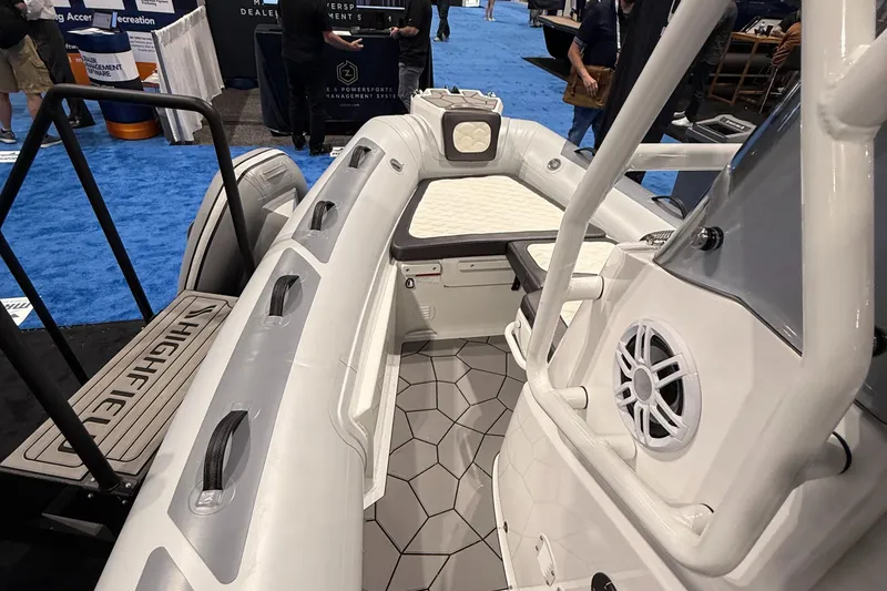 Slide: The Image of 2025 Highfield Sport 560 boat interior with modern design and seating. - 16