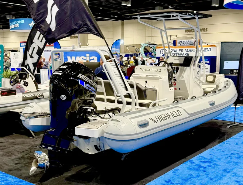 Slide: The Image of 2025 Highfield Sport 560 boat displayed at a marine exhibition. - 19