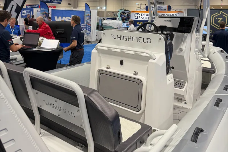 Slide: The Image of 2025 Highfield Sport 560 boat displayed at a marine exhibition. - 3