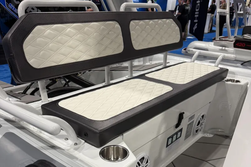 Slide: The Image of Highfield Sport 560 2025 boat seating with quilted upholstery and integrated cup holders. - 7