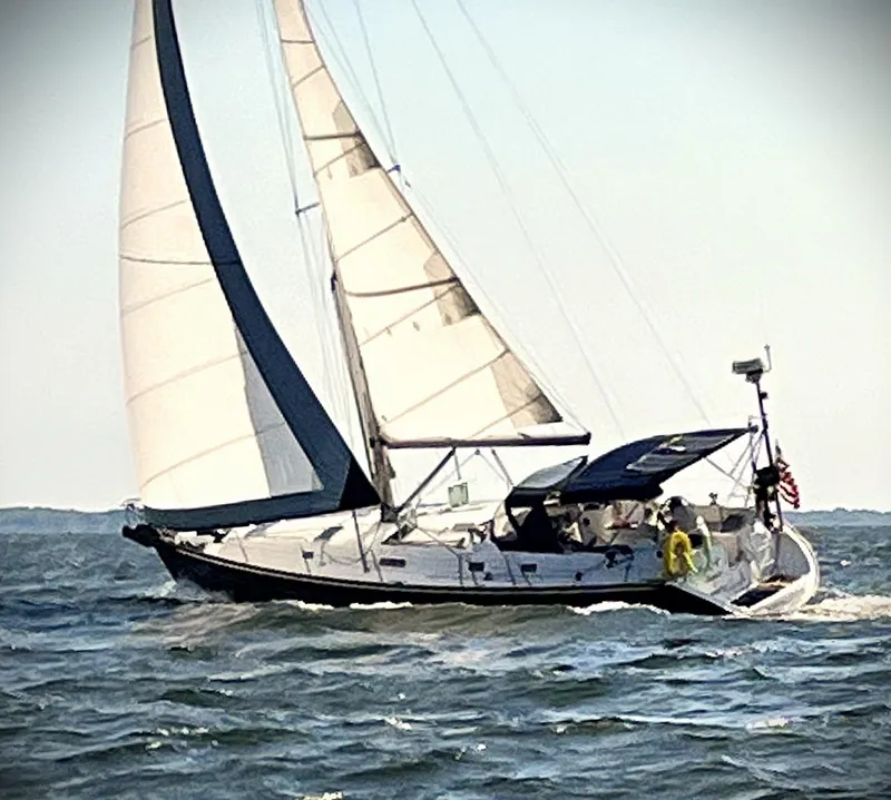 Slide: The Image of Sailing yacht Beneteau 411, 2002 model, navigating through open waters. - 0