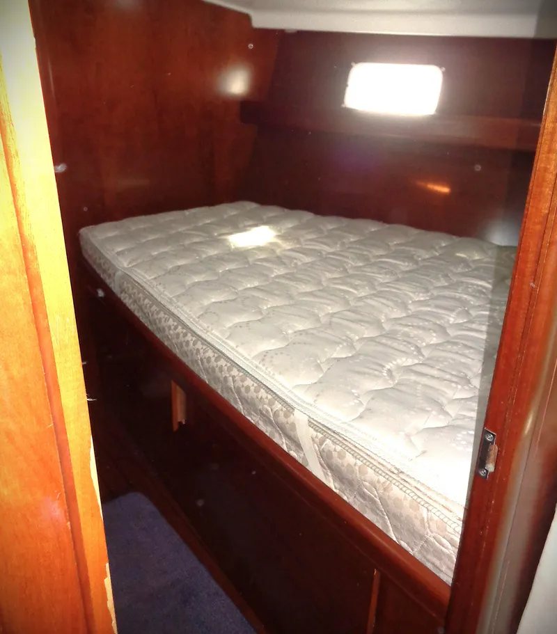 Slide: The Image of Interior cabin of 2002 Beneteau 411 sailboat with a comfortable bed. - 10
