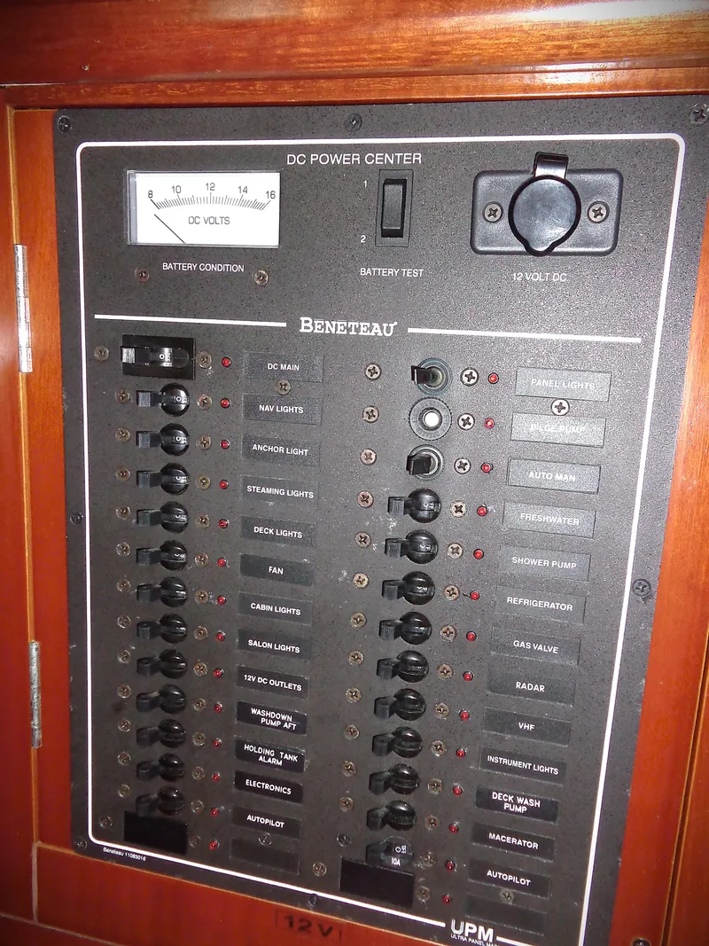 Slide: The Image of Electrical panel of a 2002 Beneteau 411 sailboat, featuring DC power controls. - 13