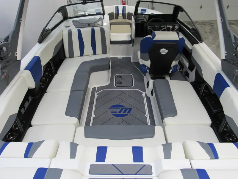 Slide: The Image of 2025 Malibu Wakesetter 22 LSV interior with blue and white seating, modern design. - 3