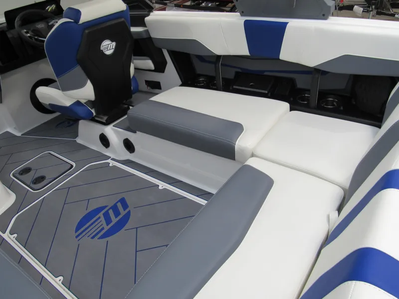 Slide: The Image of 2025 Malibu Wakesetter 22 LSV interior with blue and white seating and logo detailing. - 4