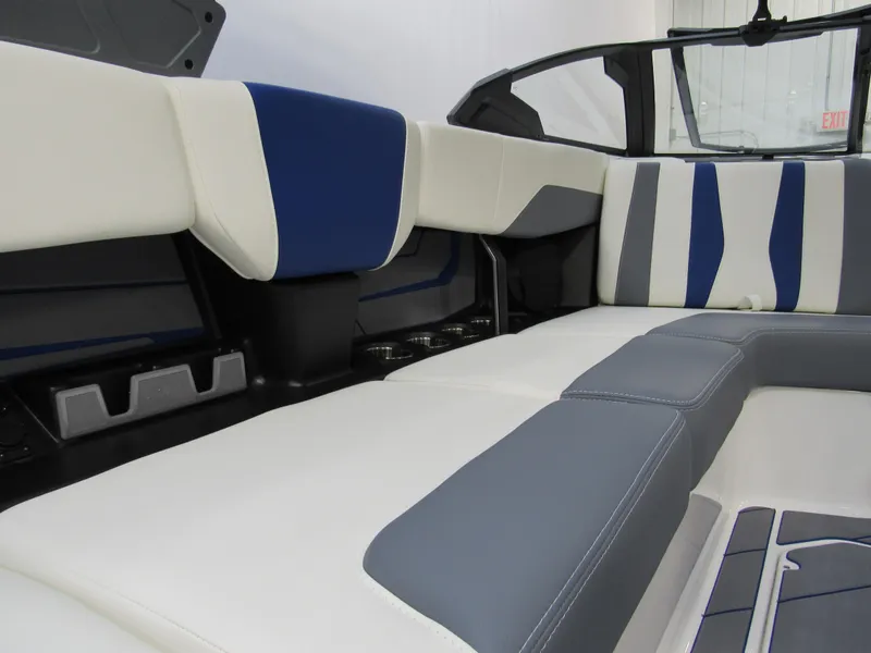Slide: The Image of 2025 Malibu Wakesetter 22 LSV interior with stylish blue and white seating. - 6