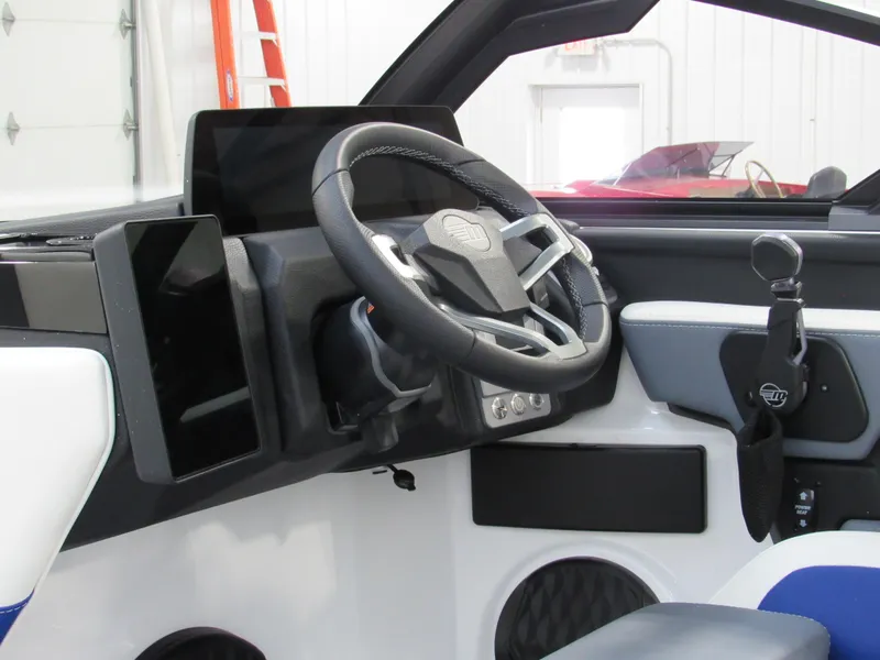 Slide: The Image of 2025 Malibu Wakesetter 22 LSV interior dashboard with steering wheel and controls. - 8